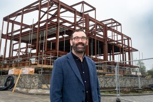 CEO, Adam Walsh, standing in front of Quarry House